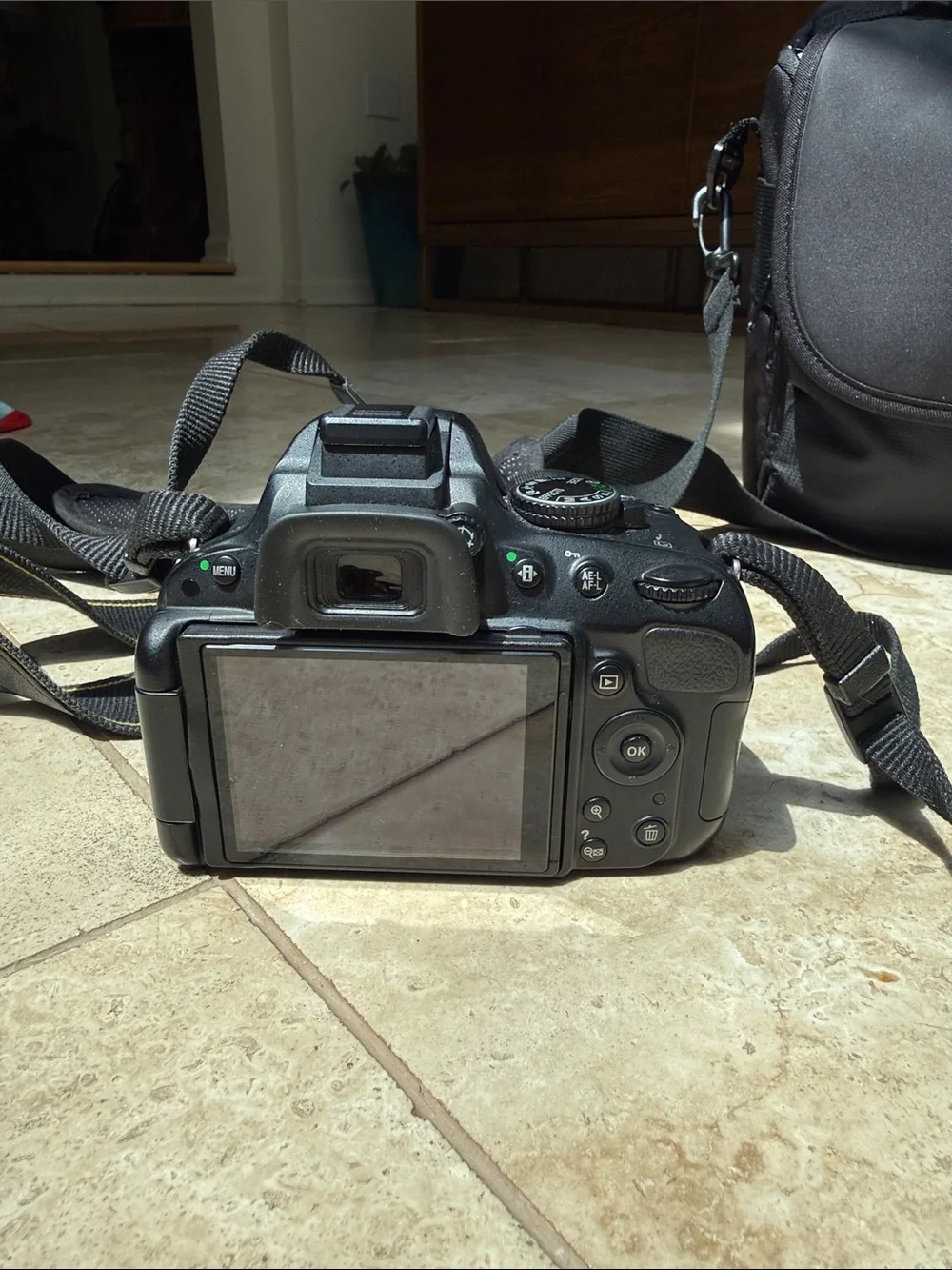 Nikon D5100 DSLR camera, 18-55mm lens, extra zoom 55-200mm, accessories, & bag